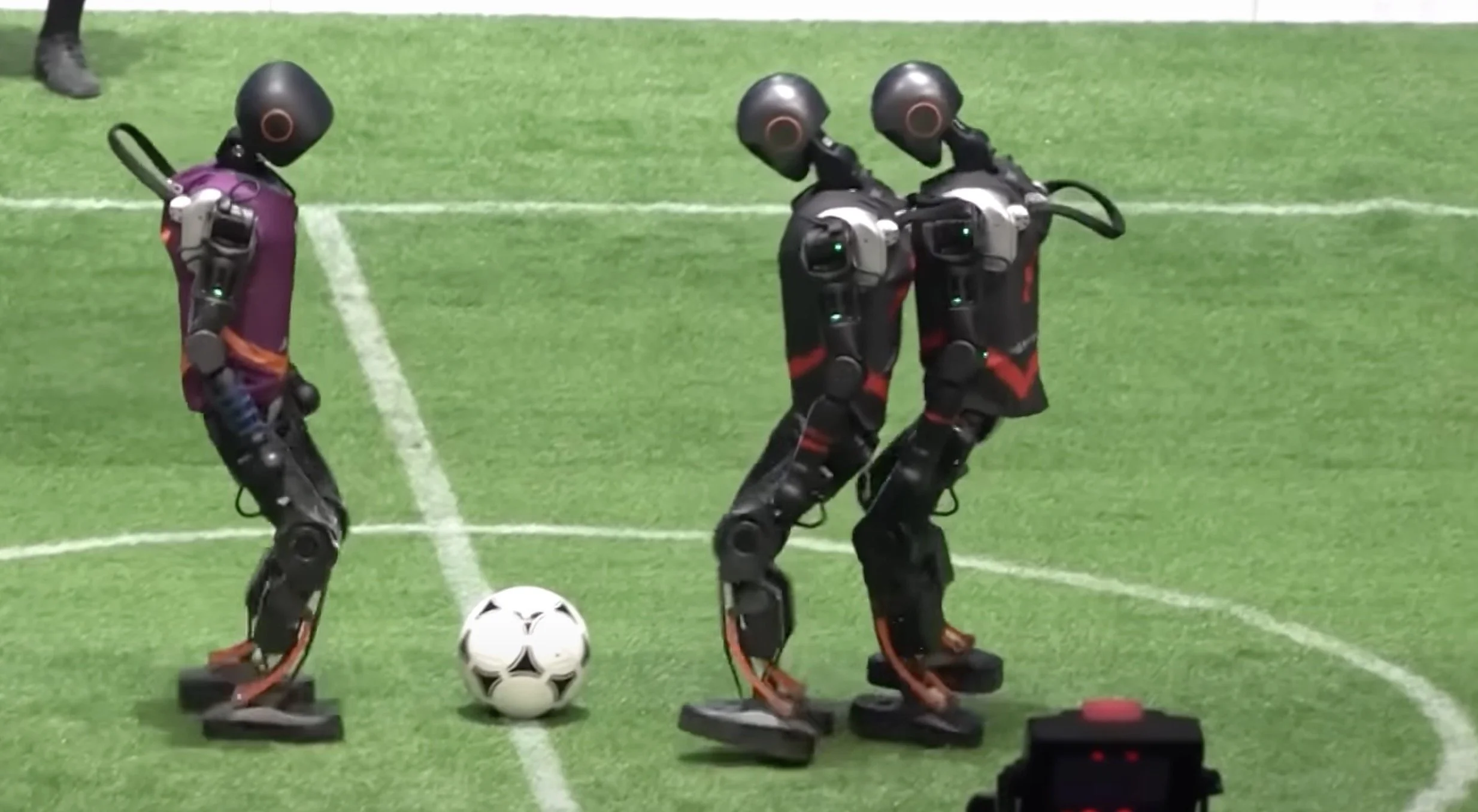 Look at humanoid robots playing football and is magnificently embarrassing